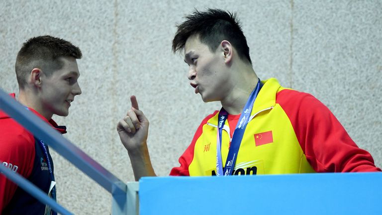 Sun Yang in an exchange with Duncan Scott after the British swimmer refused to share the podium with him at the World Championships